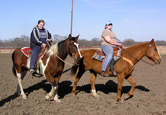 Katie Clark and Samantha Evans warm up their horses